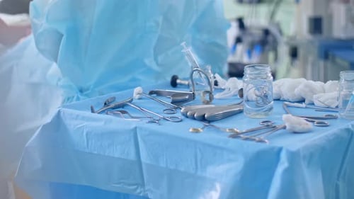 Sterile Surgical Instruments on Table in Operating Room