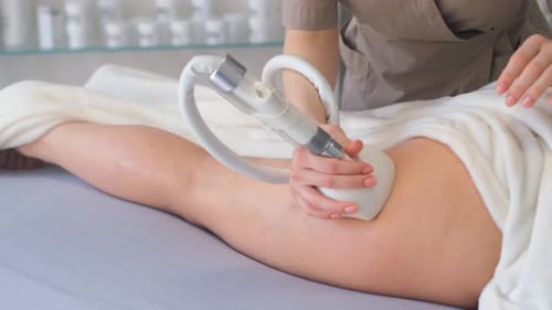 Woman Getting Beauty Treatment on Thigh