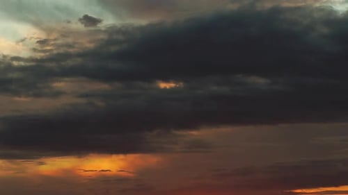A beautiful view of the gently moving clouds in the sky, the clouds take the orange and purolvous co