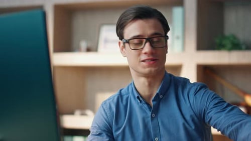 Positive Freelancer Speaking Computer Video Call at Office Closeup. Friendly Smiling Man
