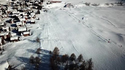 view of a ski slope and the village of Saas Fee, Switzerland