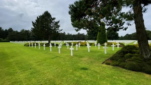 Row of US military graves with white cross. American war cemetery D-Day Soldiers Normandy, Collevill