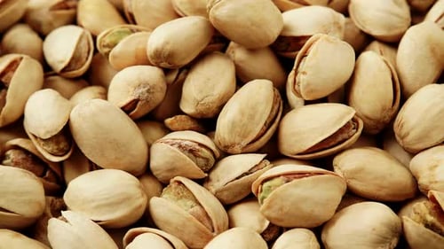 Close-up of fresh pistachios in shells