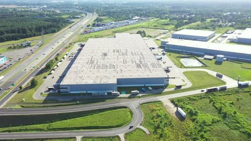 Aerial view of goods warehouse. Logistics center in industrial city zone from above. Aerial view of