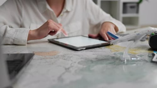 Operator, Experienced Consultant Concentrated Works On An Electronic Tablet. Tablet Screen, Indoors