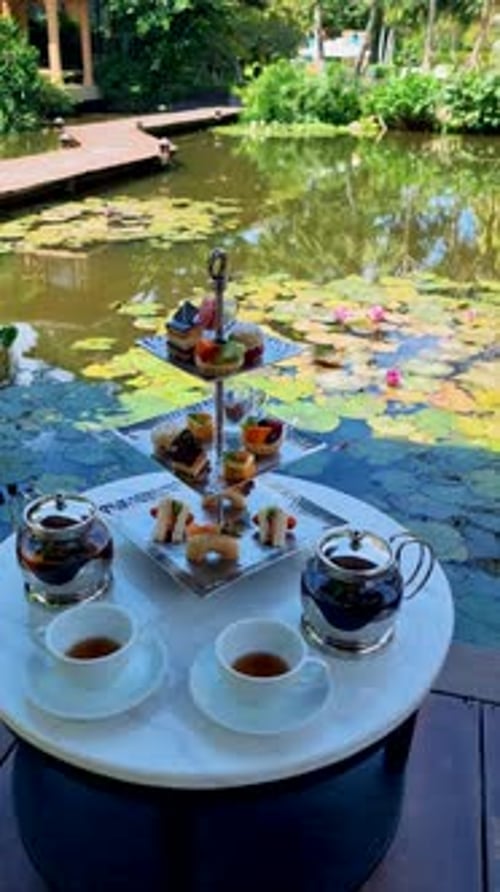 Afternoon Tea at a Water Pond High Tea in Tropical Garden in Thailand