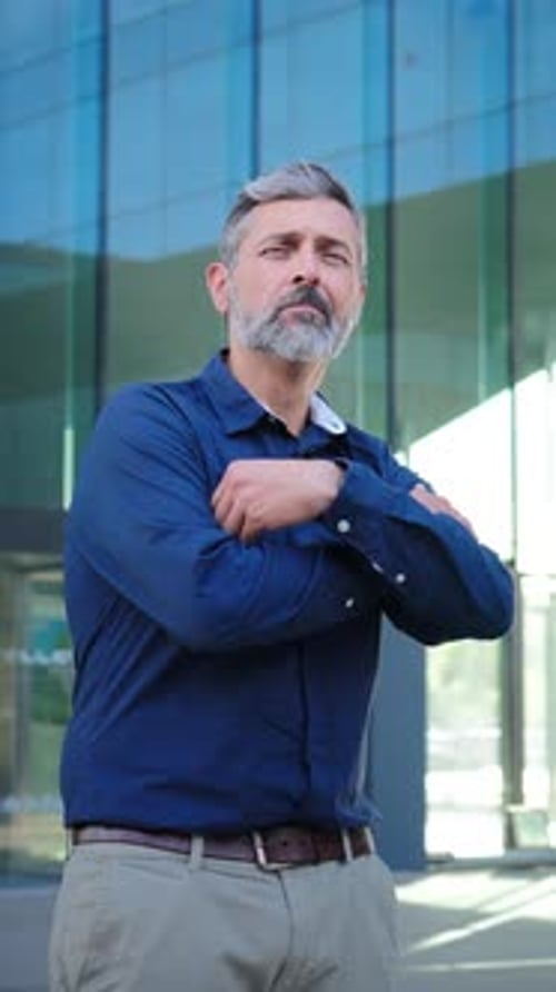 Close Up Vertical Portrait of a Mature and Formal Business Man with a Reliable and Confident