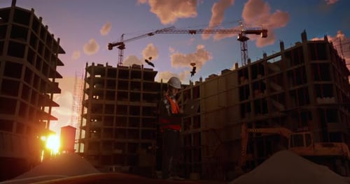 Full Body Side View Of Asian Male Engineer Working On A Laptop While Standing At Construction Site