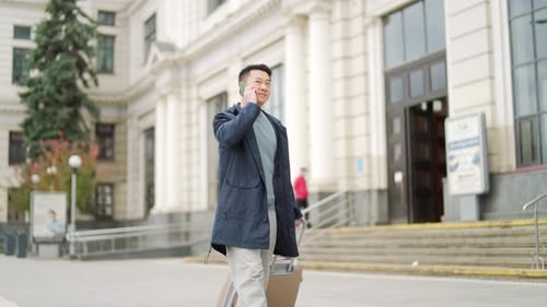 Happy Man asian passenger arrives or departure with suitcase, tourist at the railway train station