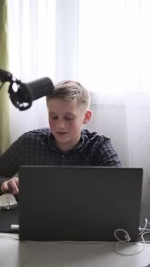 Teenager Studying Online with Laptop and Notebook Distance Learning and Education at Home