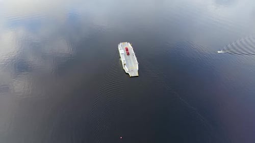 Overhead Drone Shot Of Car Ferry Crossing Still Blue Water