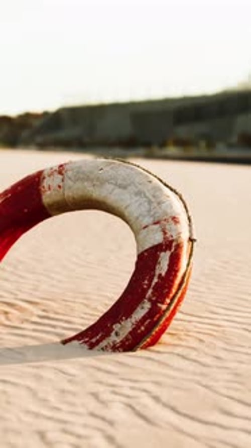 Lifebuoy on the City Beach at Sunset