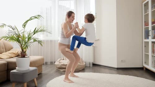 Woman and Child Working Out Together at Home