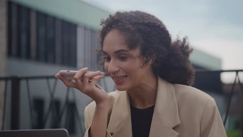 Woman Using Voice Command Feature on Smartphone