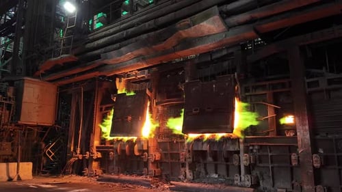 Molten Copper Flames at Industrial Smelter Furnace