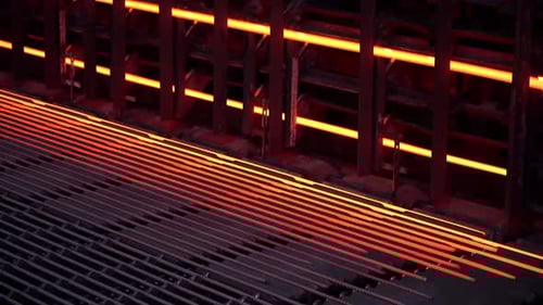 Mild steel in a steel mill. Steel production. Mechanized steel production.