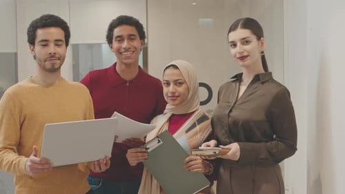 Smiling Professionals in Modern Office Environment