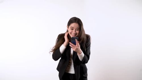 Woman Reacts Joyfully to Mobile Phone News