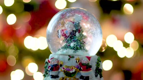 Christmas Decoration Theme, Snowflake Globe with Snowman and Christmas Tree and Out of Focus Lights