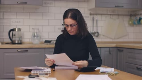 Having Financial Problems Concept Woman in Black Clothes Reading Papers Upset