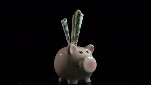 Accumulating money in spinning piggy bank.