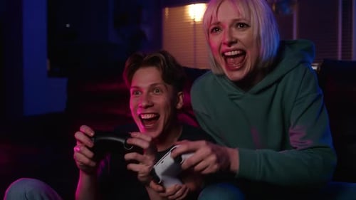 Friends Playing Video Games with Neon Lights