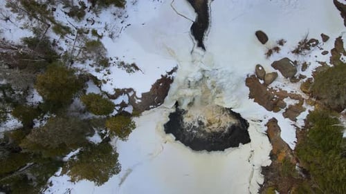 Reveling scene of a little frozen waterfall on an forest beautiful North Minnesota.