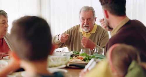 Multi-Generational Family Enjoying a Meal Together at Home