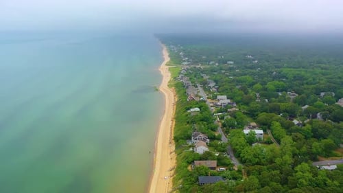 Cape Cod Beachfront Community with Cloudy Skies and Sandy Coast