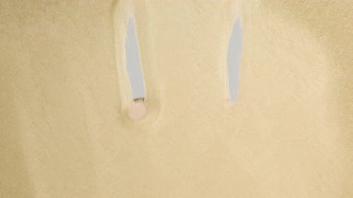 Finger Draws a Smiley Face on a Golden Background
