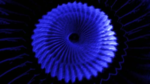 Un enorme y largo resorte de color azul se mueve en espiral en animación