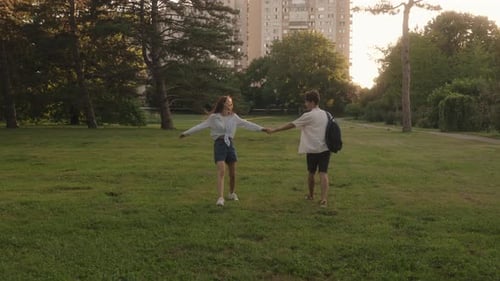 Couple Holding Hands In Park