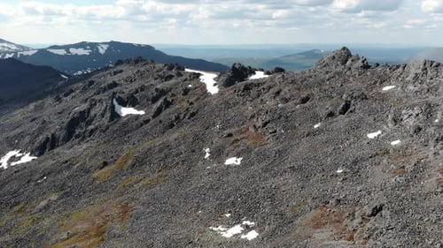Aerial Photograph Capturing Rough Rocky Slopes At High Altitudes With Limited Plant Growth Media