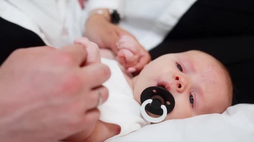 Adorable Infant Relaxing with Pacifier
