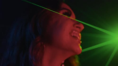 Woman Smiling in Red and Blue Light