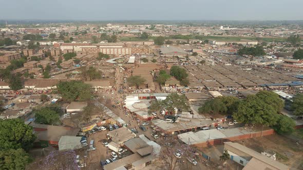 Aerial footage of a crowded and busy, Mbare Musika, and Matapi flats ...