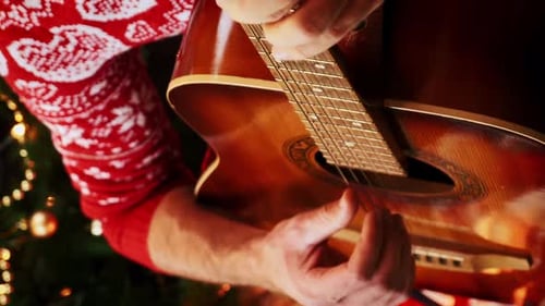 Guitar Music Plays near Decorated Christmas Tree