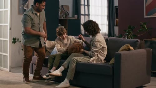 Father Introduces Small Dog to Son and Partner