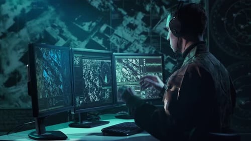 Military Soldier Operating Advanced Technology in a Command Center