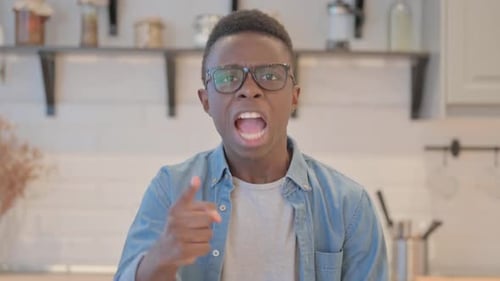Young Man Shouting and Arguing Indoors
