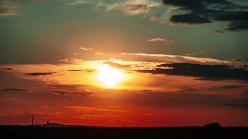 Dramatic Golden Sunset with Clouds and Horizon