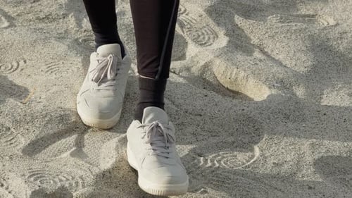 Shoes Walking On The Beach