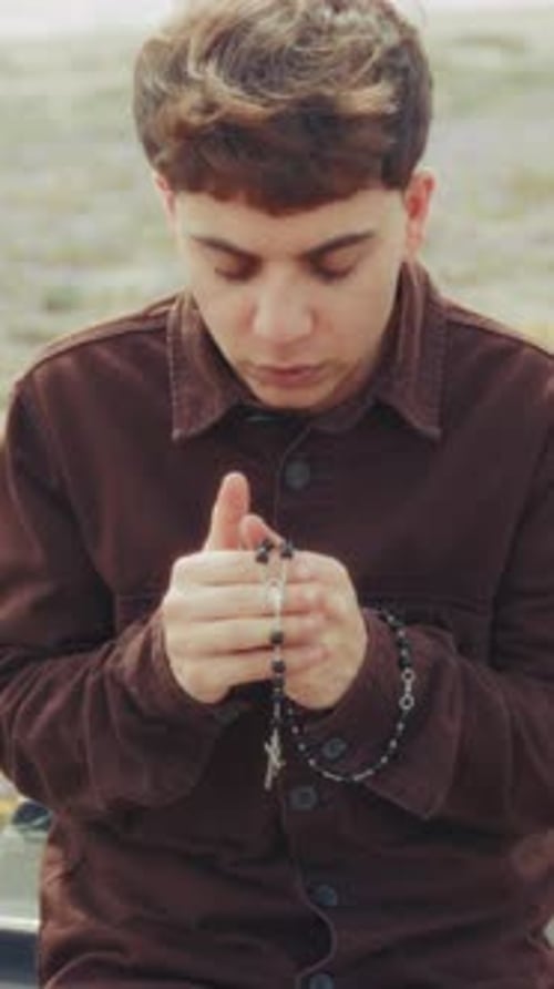 Intense Moment Of Prayer For A Christian Man On The Beach