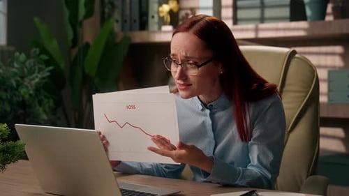 Worried Caucasian Business Woman Talking Laptop Online Call Reviewing Loss Chart Analyzing Sales