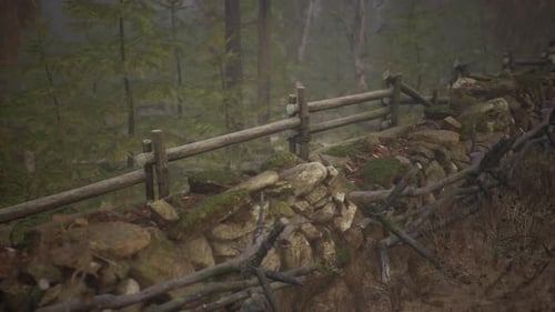 An Old Wood Fence with a Country Field Behind It