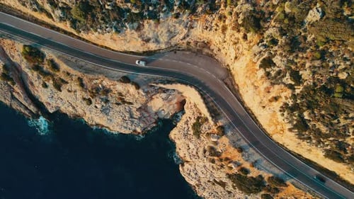 Aerial Top View of a Car Driving Along the Coastal Landscape Turkey