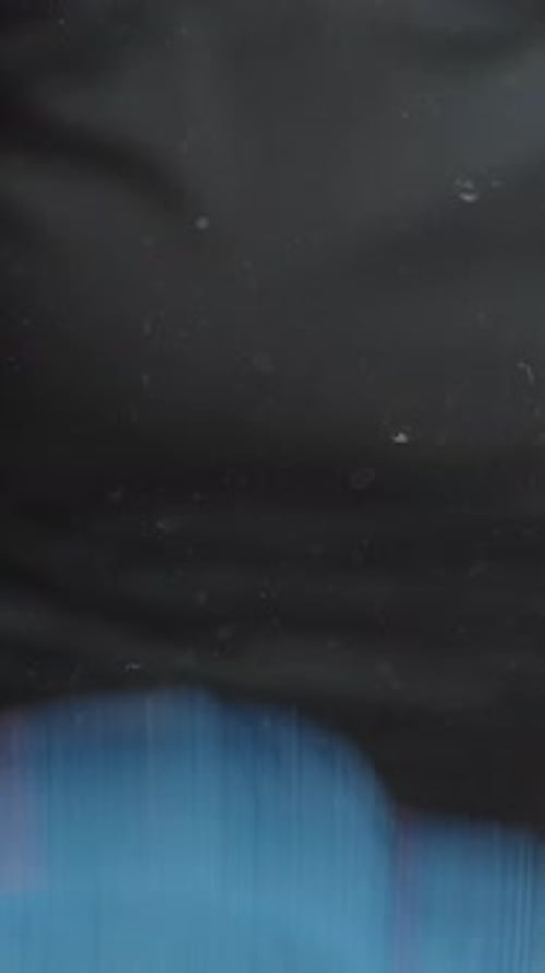 Hands Applying Cleaning Solution to Surface