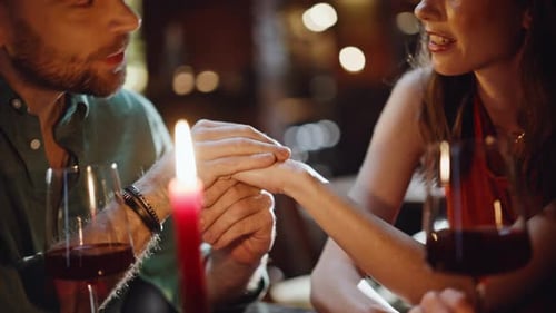 Cheerful Pair Enjoy Conversation in Intimate Cafe at Romantic Date Closeup