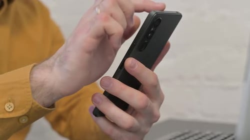 Close up of Businessman Using Phone, Typing