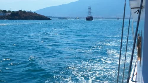 Yacht Passing Against Waves